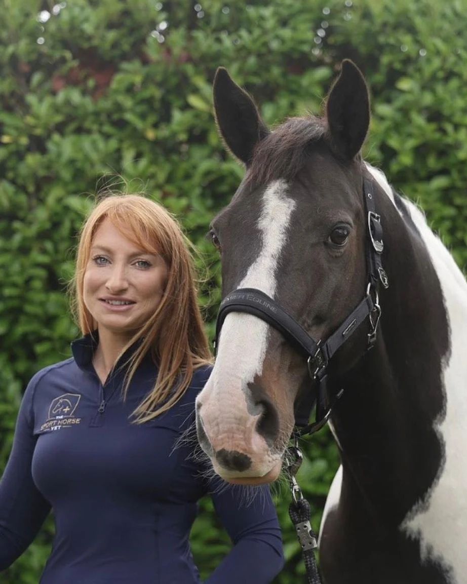 Stephanie Miller, equine veterinary surgeon, with a horse at a stable yard